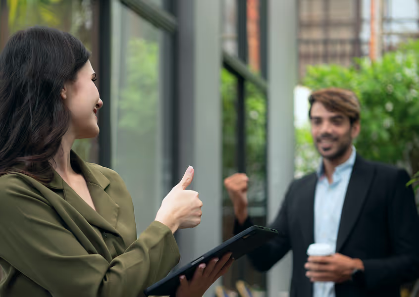 Team collaborating outside an office
